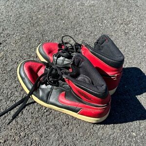 Air Jordan Nike Black and Red High-Top Sneakers with Bold Design